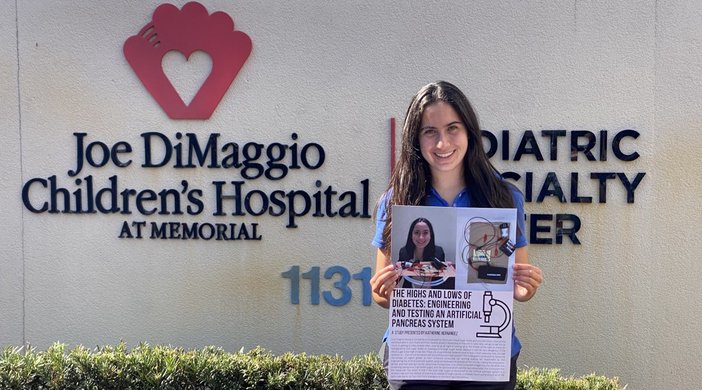 katherine holding diabetes poster jdch exterior