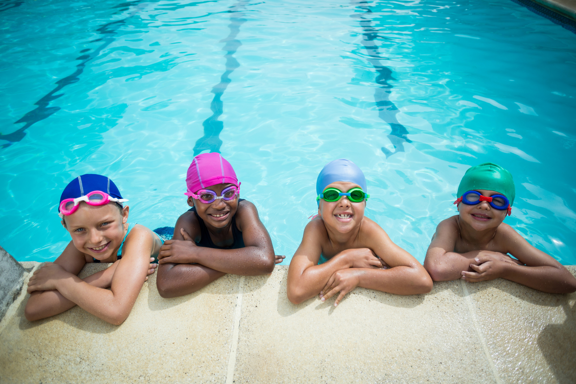 kids learning to swim in pool
