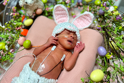 NICU baby wearing Easter bunny ears