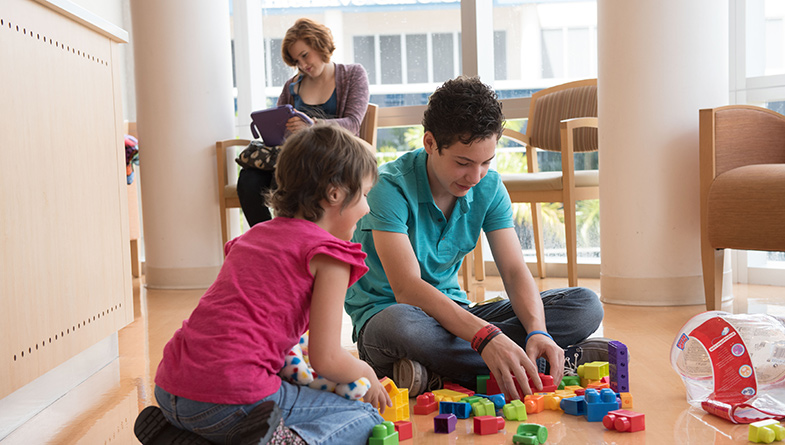 playing with toys on floor